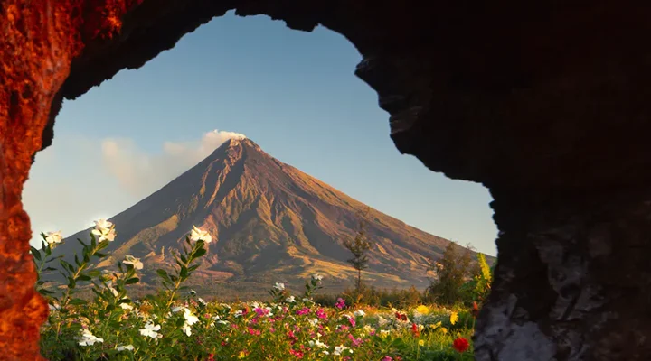 Mayon Volcano framed by a rock arch, Albay