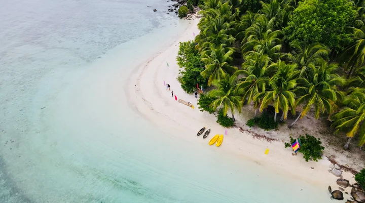 Aerial view of a curving white beach at Once Islas, Zamboanga
