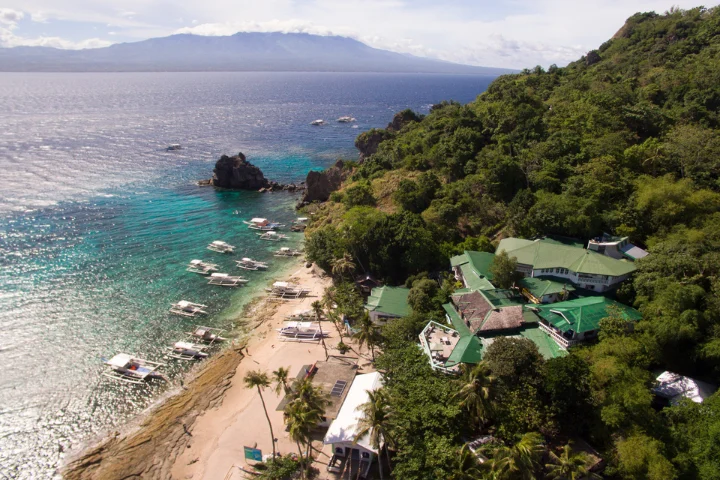 Beach and resort on the coast of Apo Island