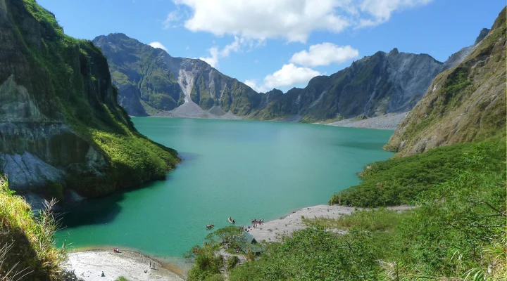 Mount Pinatubo crater lake between steep green walls