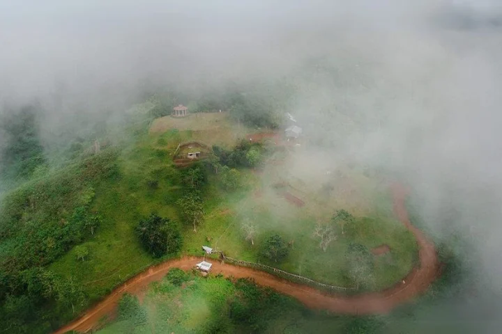 Winding road through the clouds at Puncak Tanawan