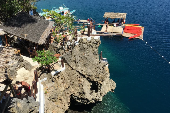 Cliff-diving platforms over the deep blue sea at Ariel's Point, Boracay