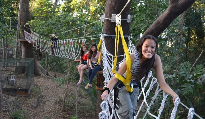 Guest on a rope course in the trees at the JEST Camp, Subic